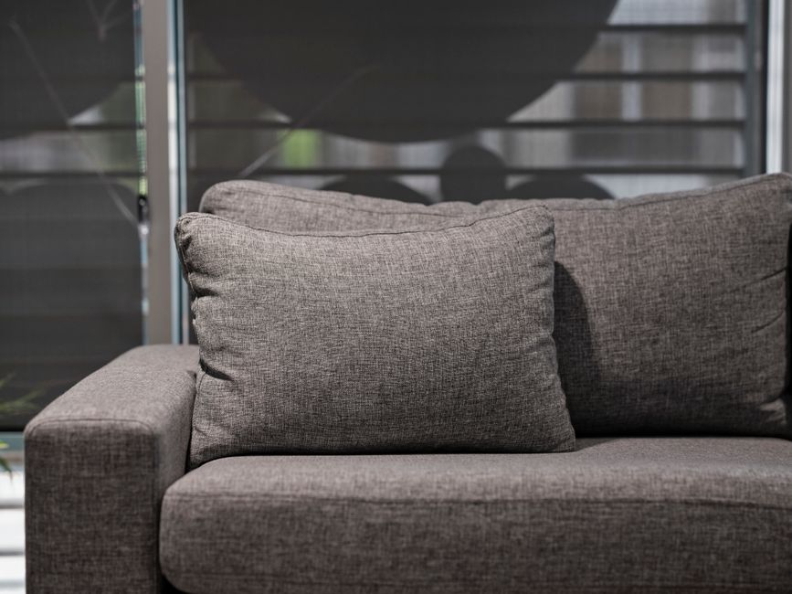 Detailed upholstery cleaning of a fabric sofa